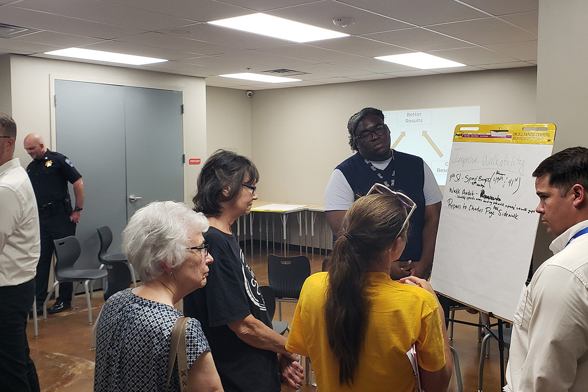 A student with the Transportation Research Internship Program through the Oklahoma Local Technical Assistance Program leads a discussion during an internship with the City of Tulsa.