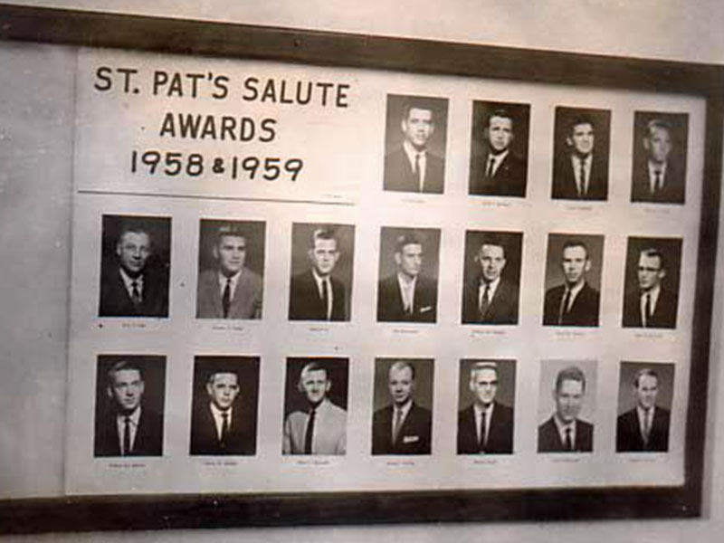 A photo of a display case that shows headshots of students who won an award