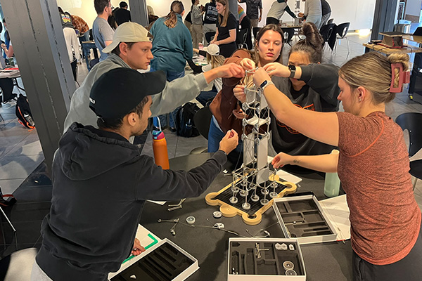 A group of OSU architecture students use Mola modleling kits during a team activity.