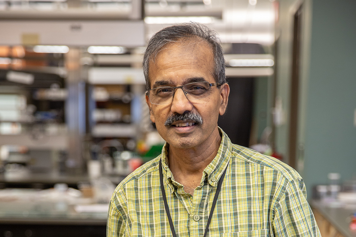 Dr. Ranji Vaidyanathan, an engineering professor at OSU-Tulsa, is pictured in a lab setting wearing a green shirt.