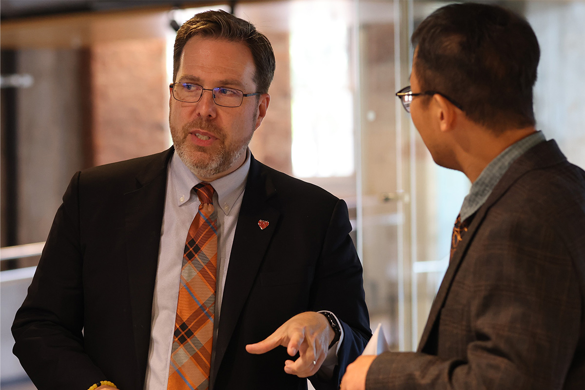 Dr. Daniel D. Burkey attends a reception after presentation