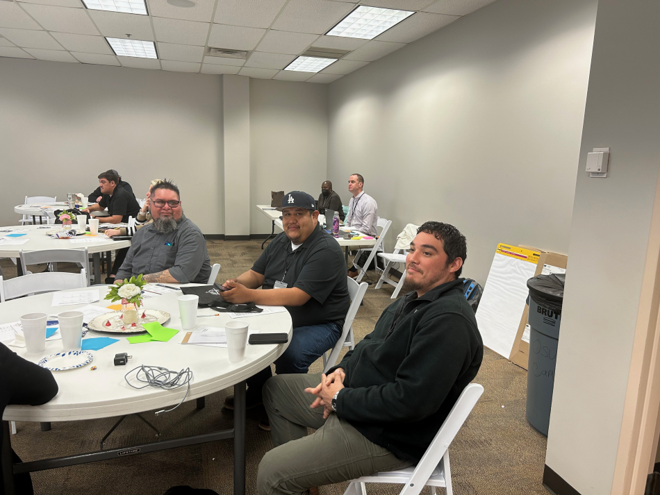 Safe System Approach for All workshop attendees seated at tables Safe System Approach for All workshop attendees seated at tables