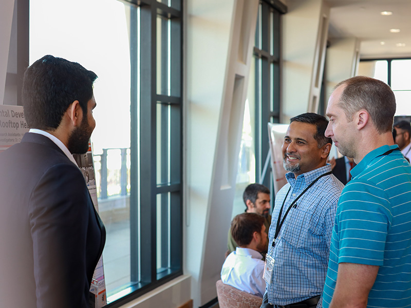 cibs-front-gal-3.jpg Students connect with industry members durring meeting poster show