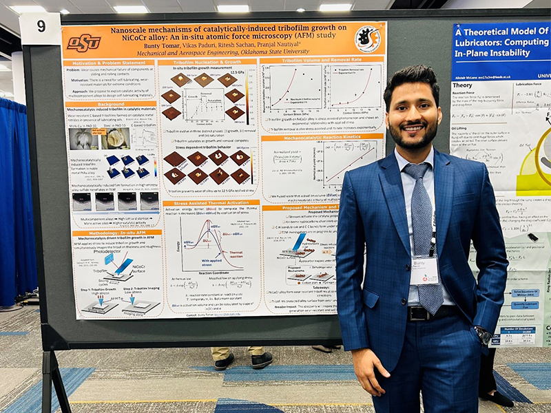 Bunty Tomar standing in front of his poster at a research seminar hosted by UCO