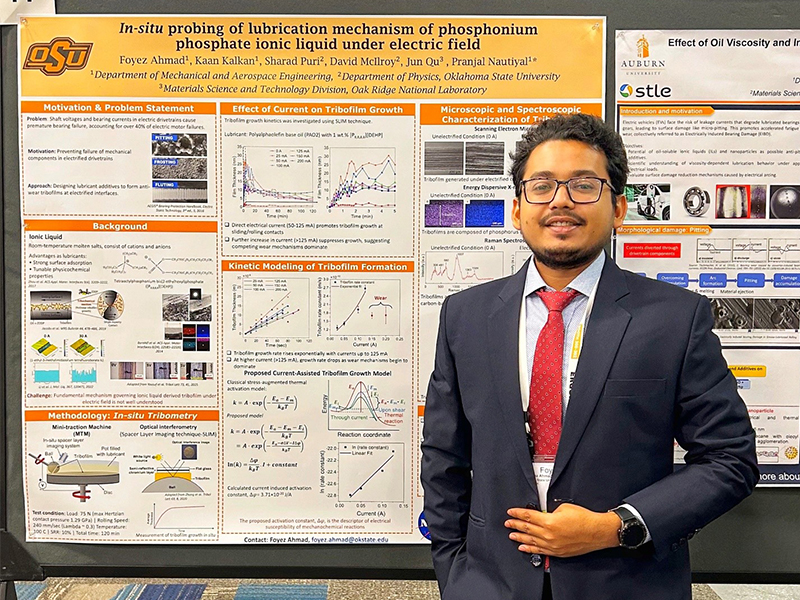 Foyez Ahmad standing in front of his poster at a research seminar hosted by UCO