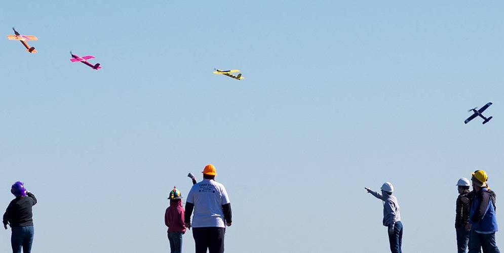 speedfest students flying colorful planes in the sky