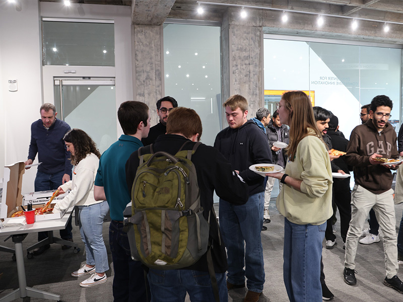 Students and professional members of ASHRAE mingle during an anniversary celebration. Students and professional members of ASHRAE mingle during an anniversary celebration.