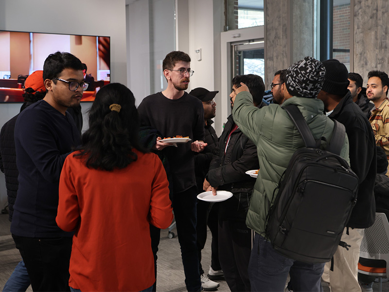 Students and professional members of ASHRAE mingle during an anniversary celebration. Students and professional members of ASHRAE mingle during an anniversary celebration.
