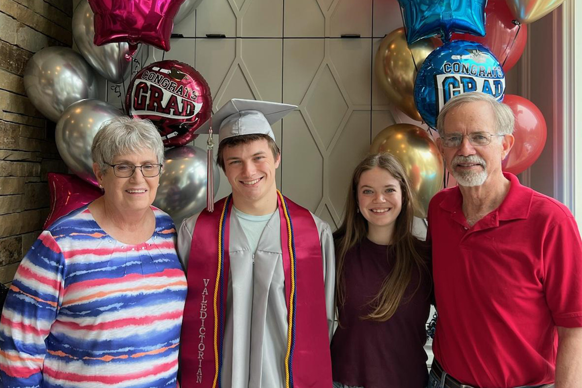 Patti and Stan Stephenson standing with two of their grandchildren who graduated in May 2024. Liam graduated as one of the Valedictorians from Edmond Memorial High School and is currently at OSU in the Mechanical and Aerospace Department. Cailin graduated Magna Cum Laude from The University of Tulsa with a Geoscience Major and Minors in Energy and Music. She is currently pursuing her MS in Geology from Binghampton University in New York state. Patti and Stan Stephenson standing with two of their grandchildren who graduated in May 2024.