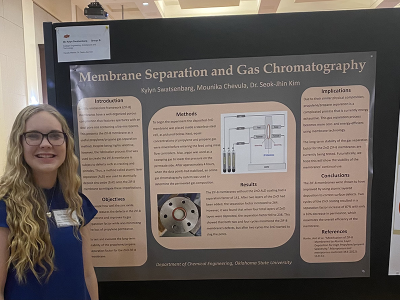 Kylyn Swatsenbarg standing next to poster at Freshman Research Scholars symposium