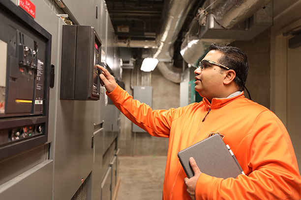 Dr. Vora examining electrical read outs