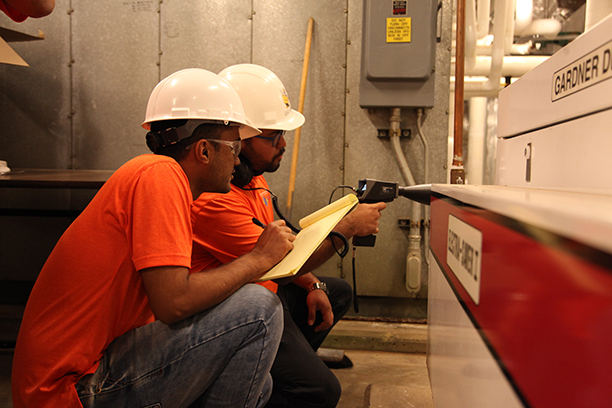 Students testing for leaks on coppper piping