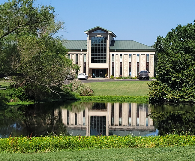 OSU Extension Center where CLGT is located with reflection in pond