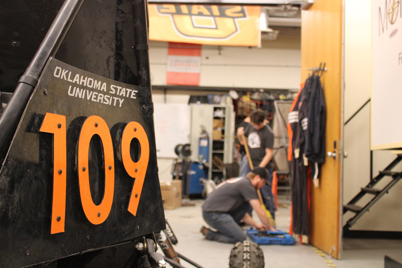 FSAE members learning about fuel pumps