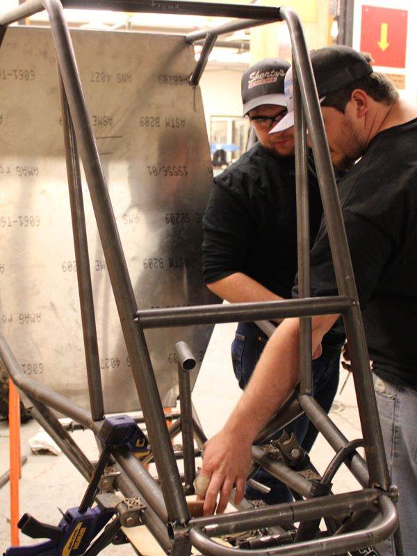 Baja students discussing frame ergonomics 