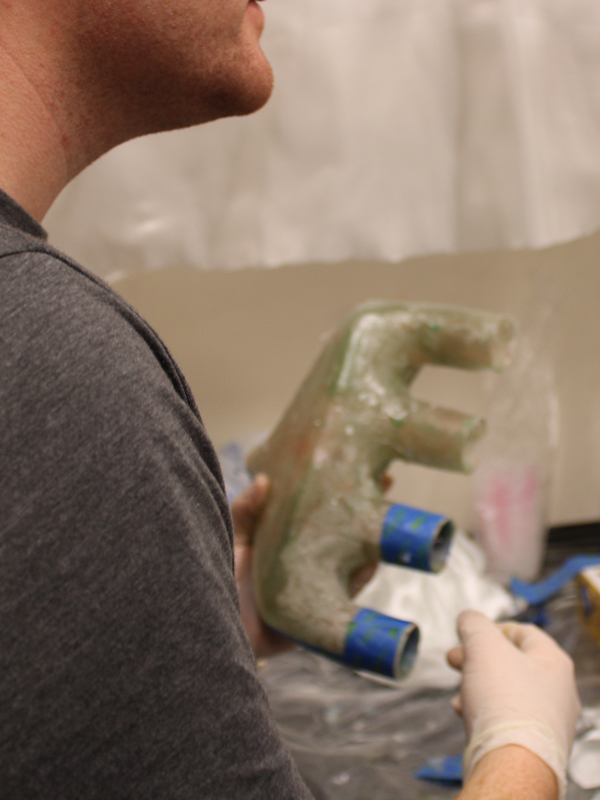 FSAE students work on building an intake plenum