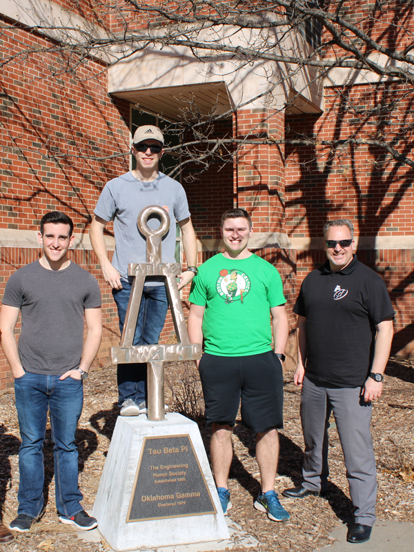 Tau Beta Pi polishing their statue for pi day