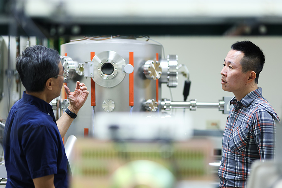 Dr. Zhang and Dr. Hu working in the Clean Room lab